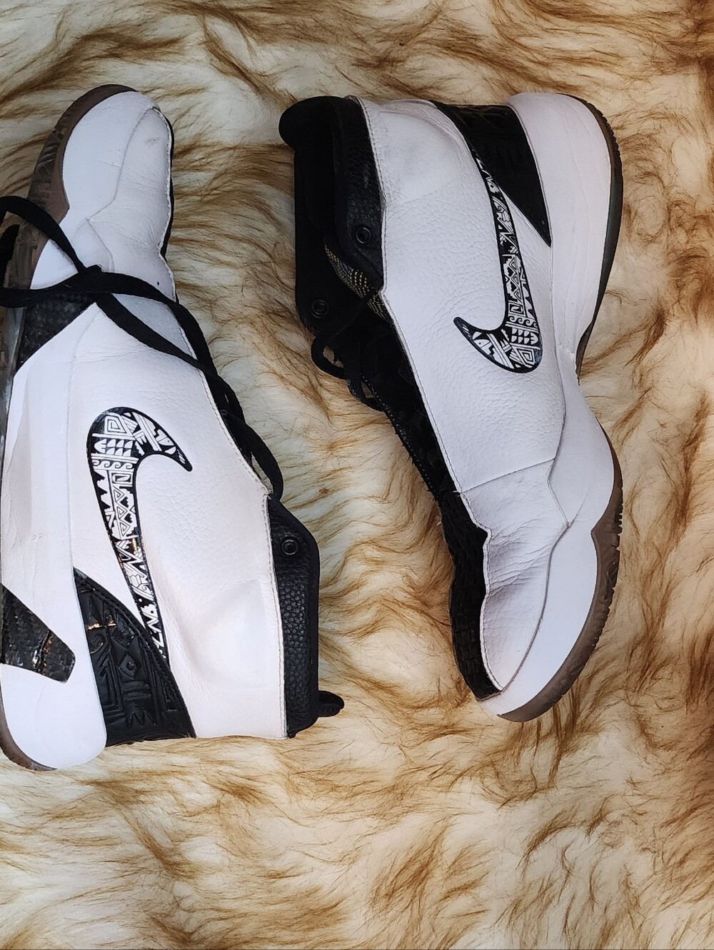 Nike Women's White and Black High-Top Sneakers with Patterned Swoosh